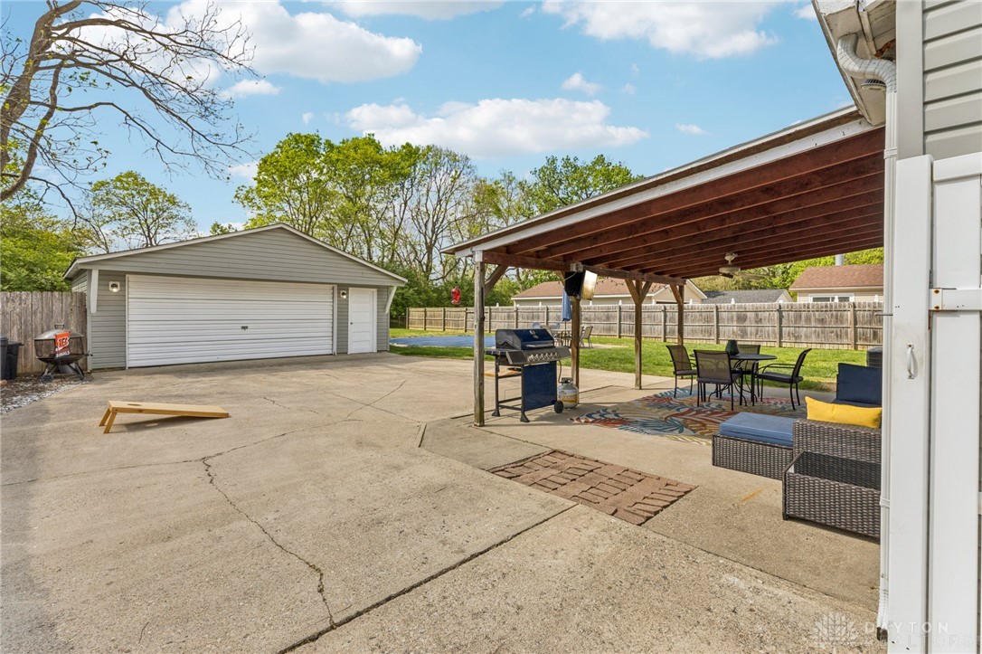 4934 Castleton Drive Fairfield, OH 45014 - Photo 26 of 36 This spacious backyard features a covered patio perfect for outdoor gatherings and a detached garage.