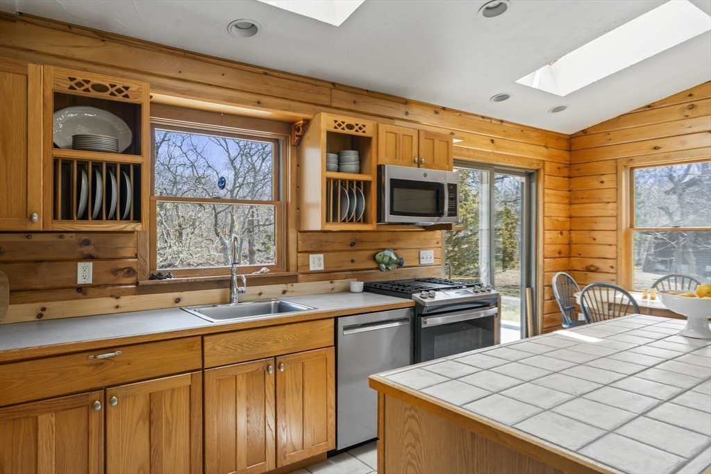 7 Pip'n Road Edgartown, MA 02539 - Photo 26 of 41 a kitchen with stainless steel appliances granite countertop a sink stove and refrigerator