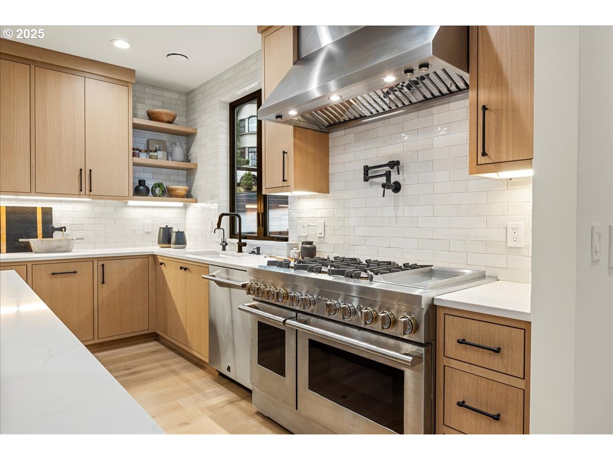 1572 Chandler Road Lake Oswego, OR 97034 - Photo 12 of 47 a kitchen with a stove and white cabinets