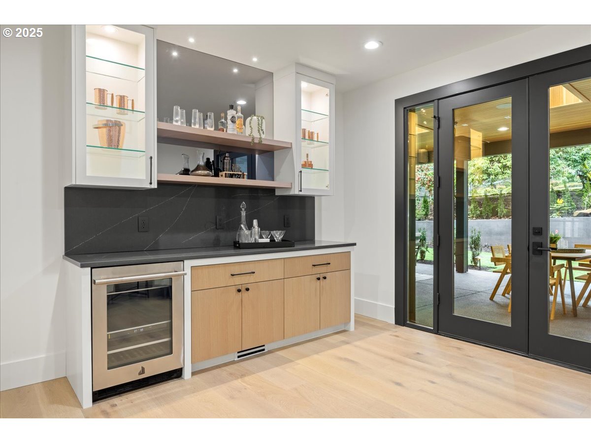 1572 Chandler Road Lake Oswego, OR 97034 - Photo 17 of 47 a kitchen with stainless steel appliances granite countertop a stove a sink and a refrigerator with wooden floor