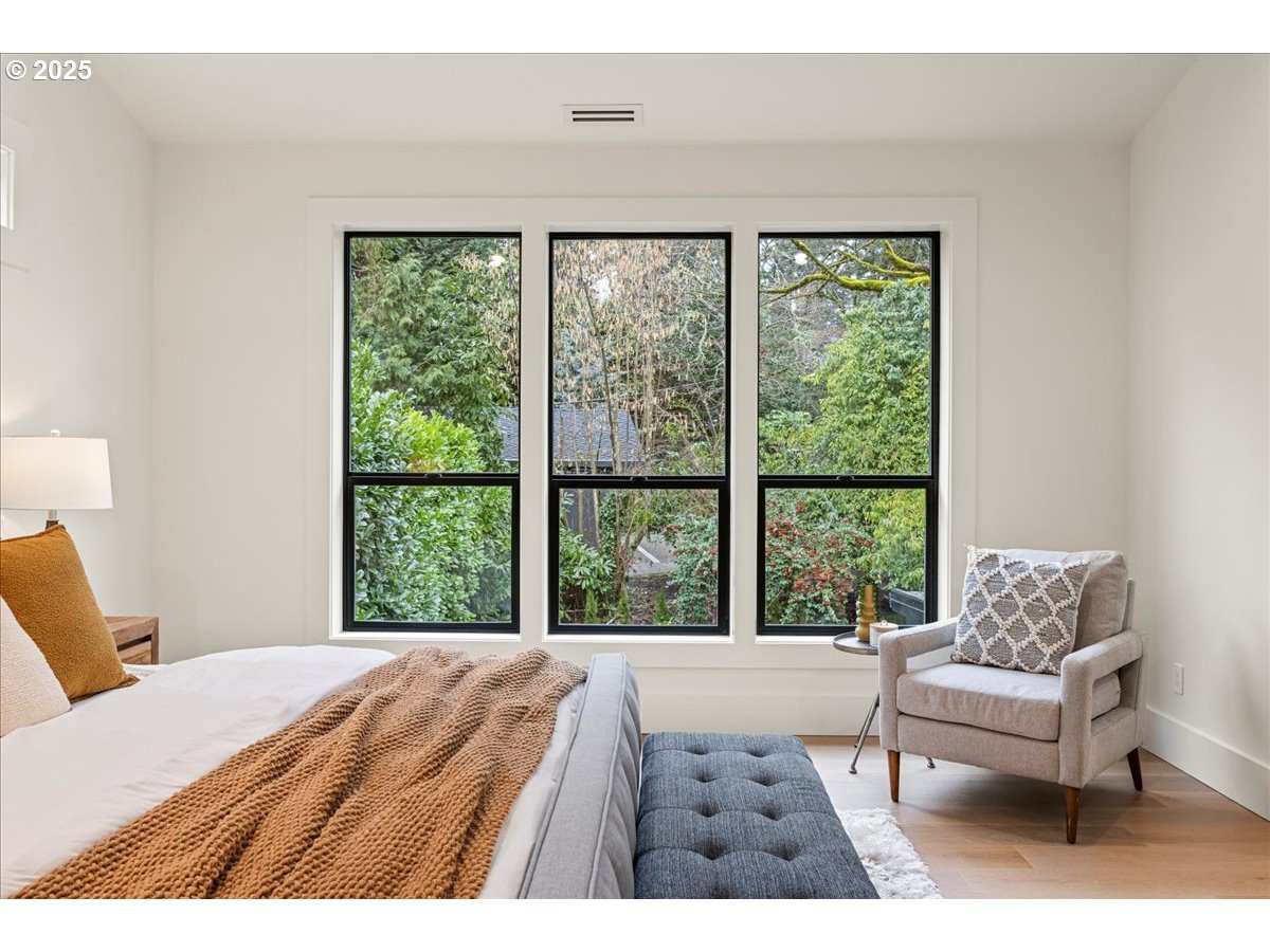 1572 Chandler Road Lake Oswego, OR 97034 - Photo 25 of 47 a bedroom with a bed and a large window