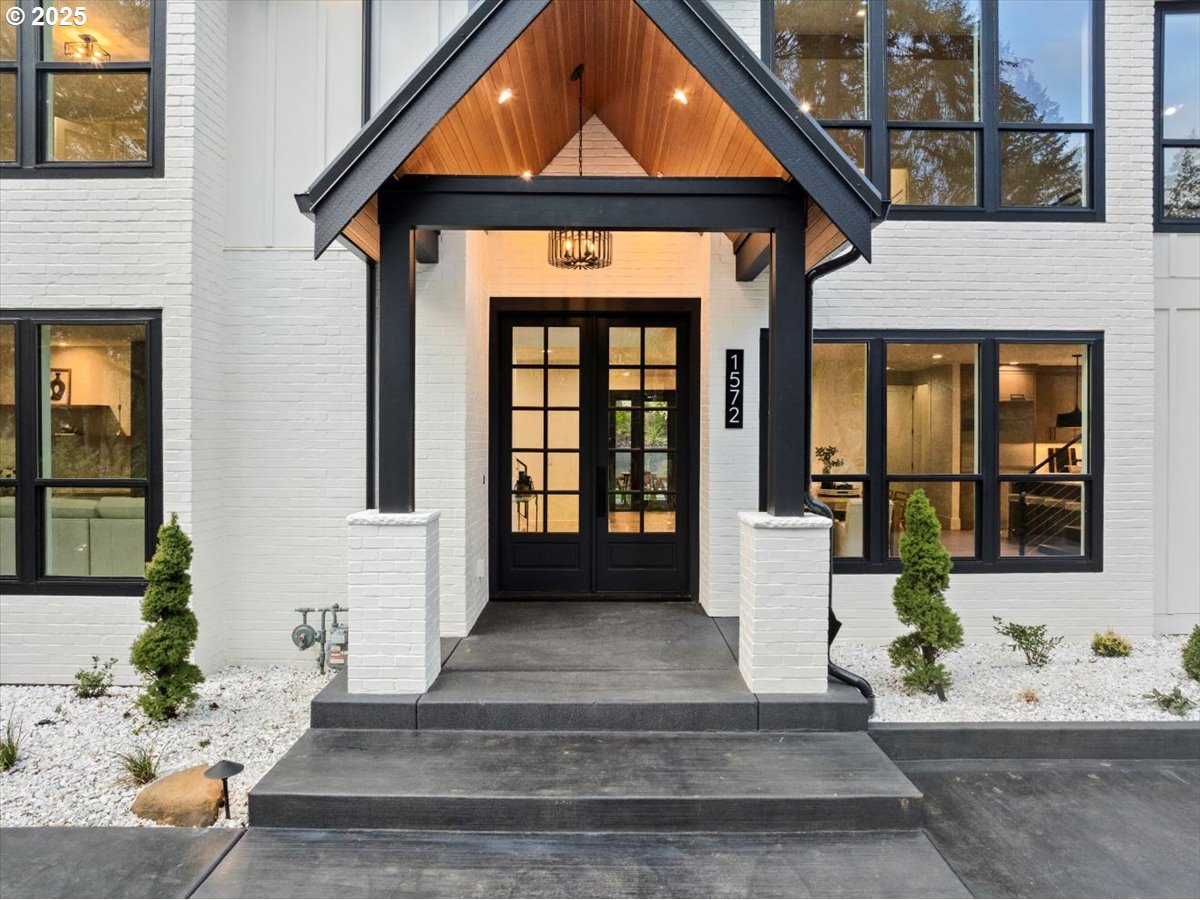 1572 Chandler Road Lake Oswego, OR 97034 - Photo 3 of 47 a front view of a house with a yard