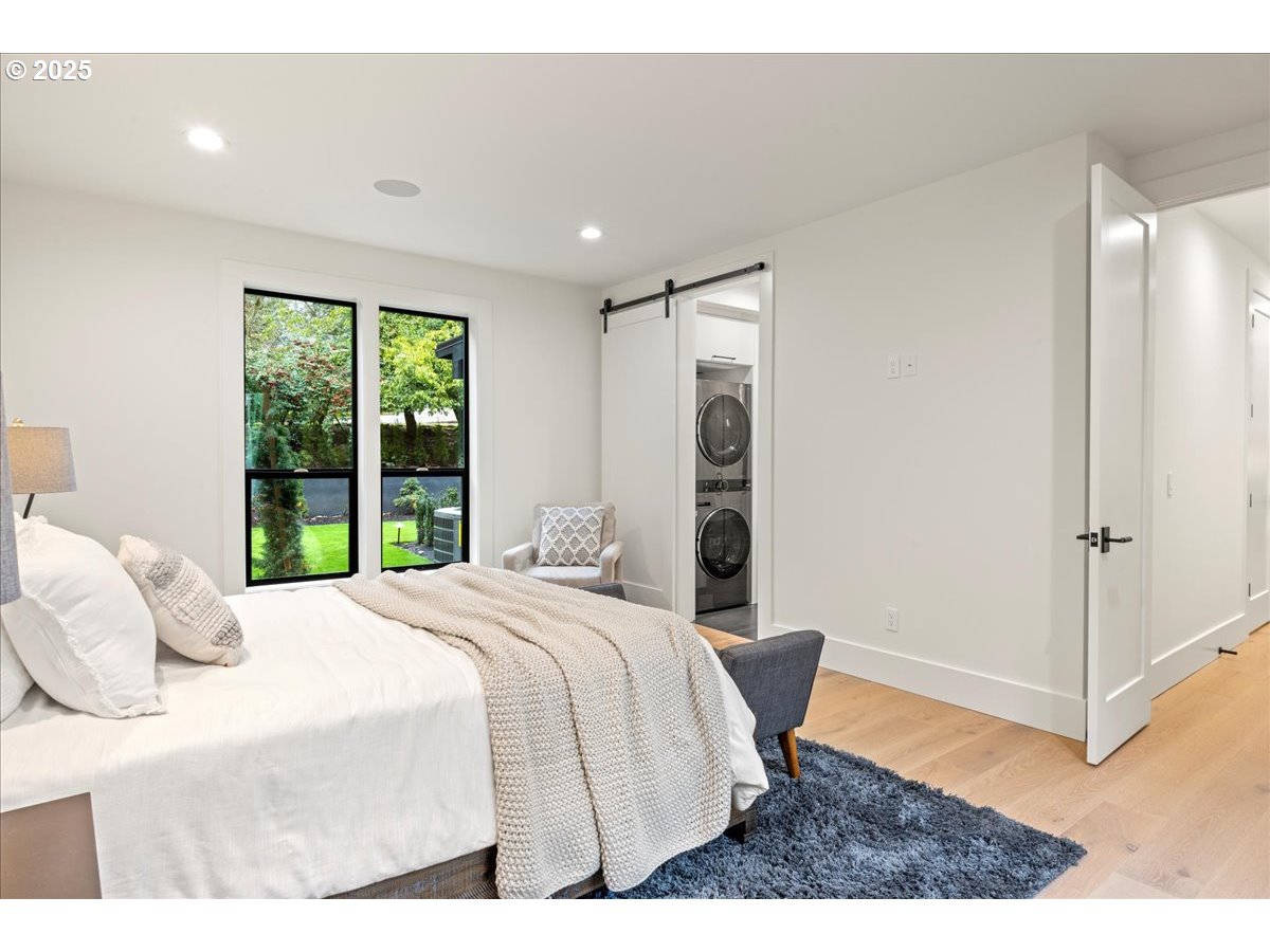 1572 Chandler Road Lake Oswego, OR 97034 - Photo 33 of 47 a bedroom with a bed and a large window