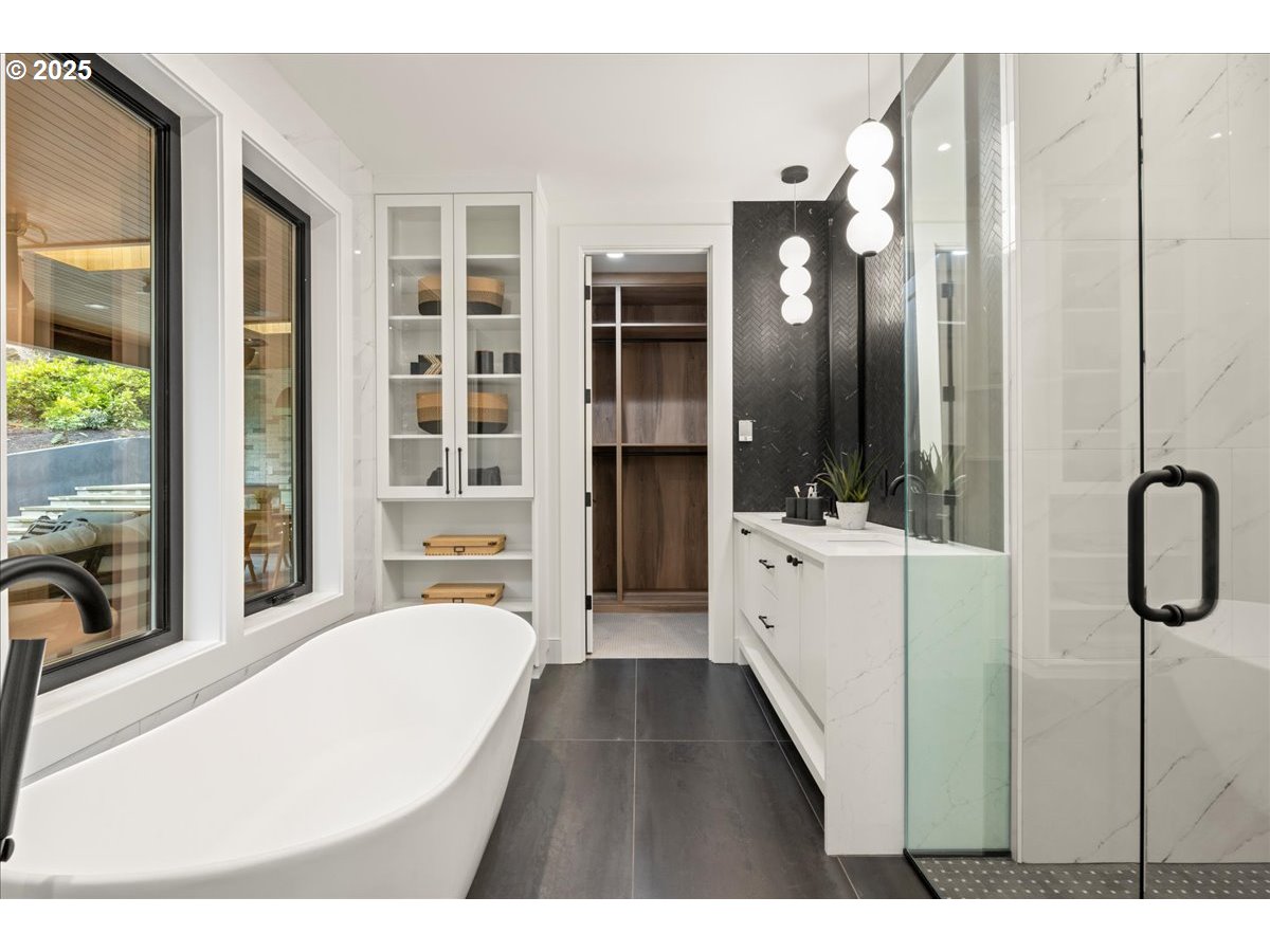 1572 Chandler Road Lake Oswego, OR 97034 - Photo 35 of 47 a view of a bathroom with tub mirror and window