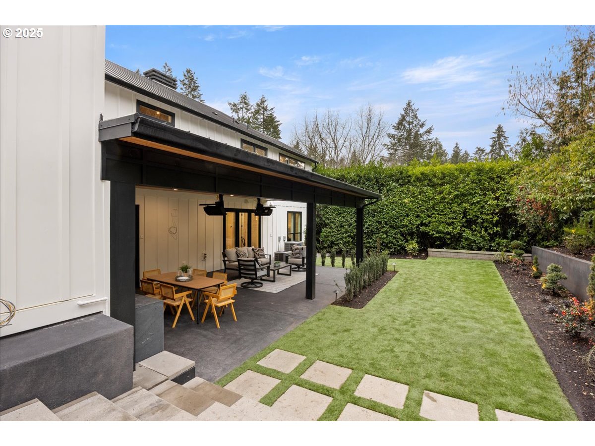 1572 Chandler Road Lake Oswego, OR 97034 - Photo 38 of 47 a view of a patio with table and chairs with wooden floor and fence