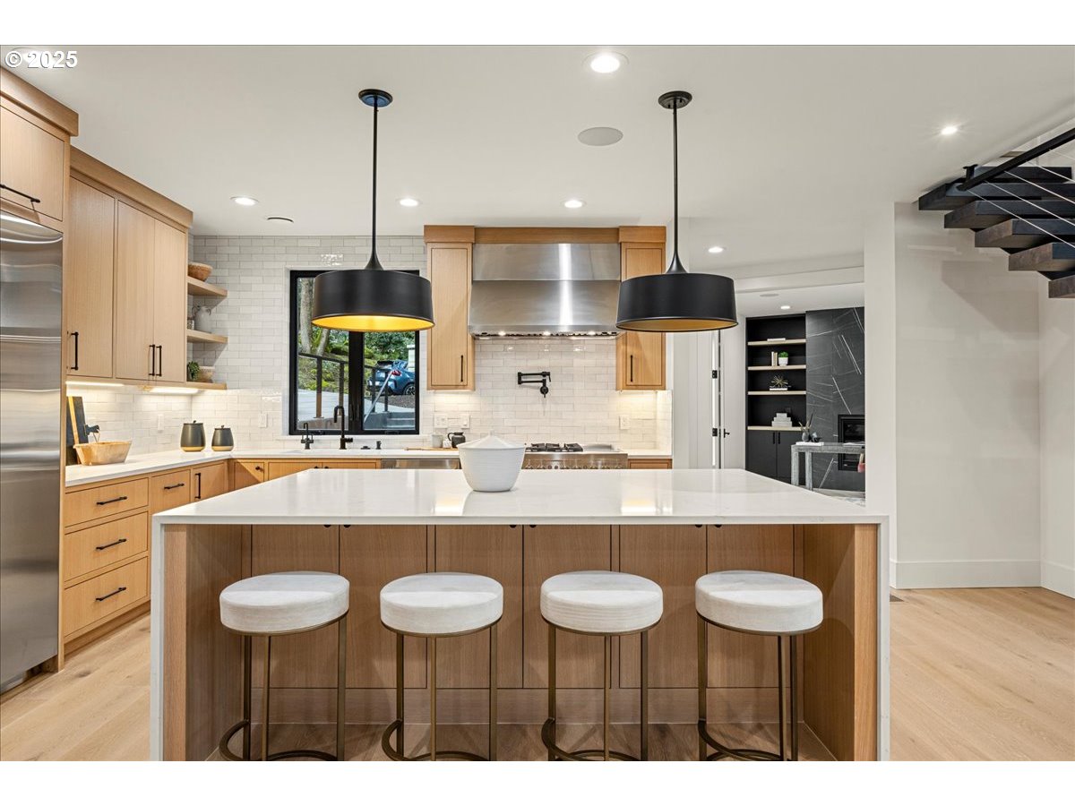 1572 Chandler Road Lake Oswego, OR 97034 - Photo 9 of 47 a kitchen with a counter a sink and cabinets