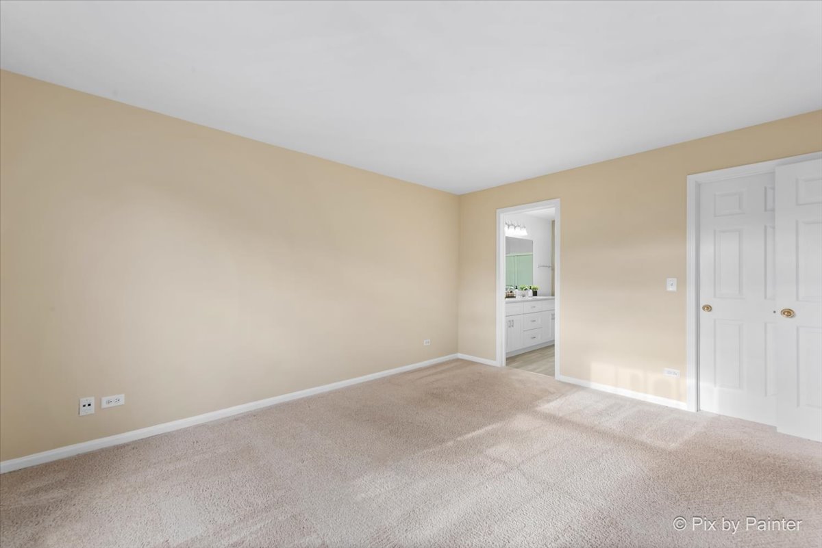 1023 Berkshire Court, Unit C Elgin, IL 60120 - Photo 19 of 54 a view of an empty room and window