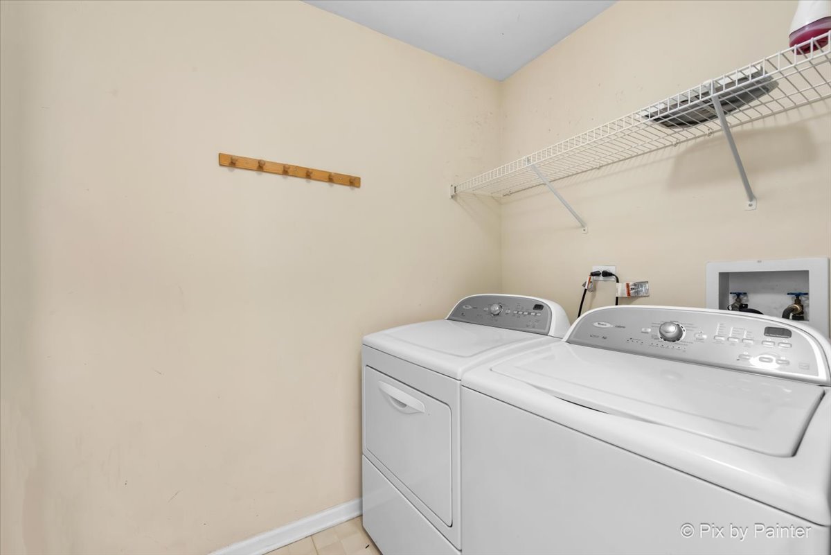 1023 Berkshire Court, Unit C Elgin, IL 60120 - Photo 24 of 54 a utility room with dryer and washer