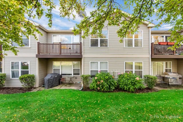 a front view of a house with porch and garden