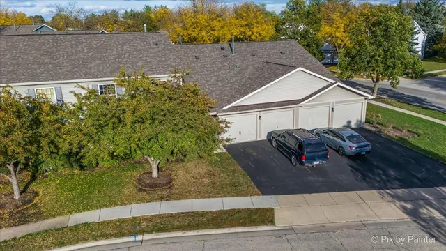 a aerial view of a house with a yard
