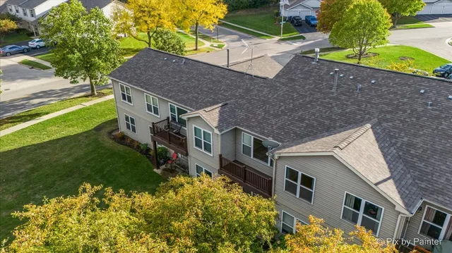 an aerial view of a house with a lake view