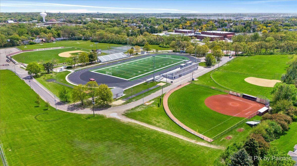 1023 Berkshire Court, Unit C Elgin, IL 60120 - Photo 53 of 54 an aerial view of a golf course with a swimming pool