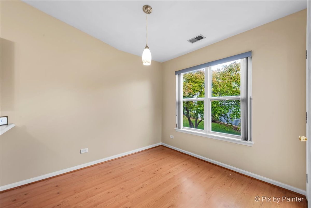 1023 Berkshire Court, Unit C Elgin, IL 60120 - Photo 10 of 54 an empty room with a window