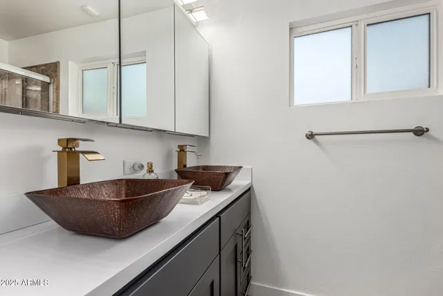 a kitchen with a sink and cabinets
