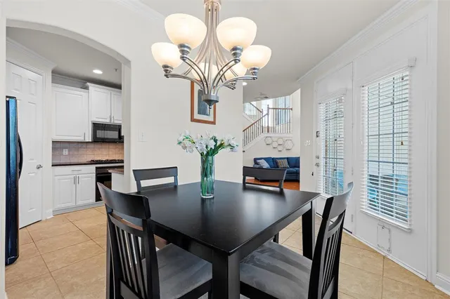 a kitchen with cabinets and stainless steel appliances