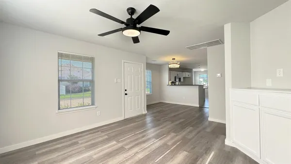 a kitchen with stainless steel appliances granite countertop a refrigerator sink and cabinets