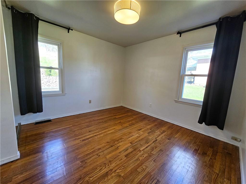 57 Old York Road Washington, PA 15301 - Photo 11 of 25 a view of empty room with wooden floor and fan