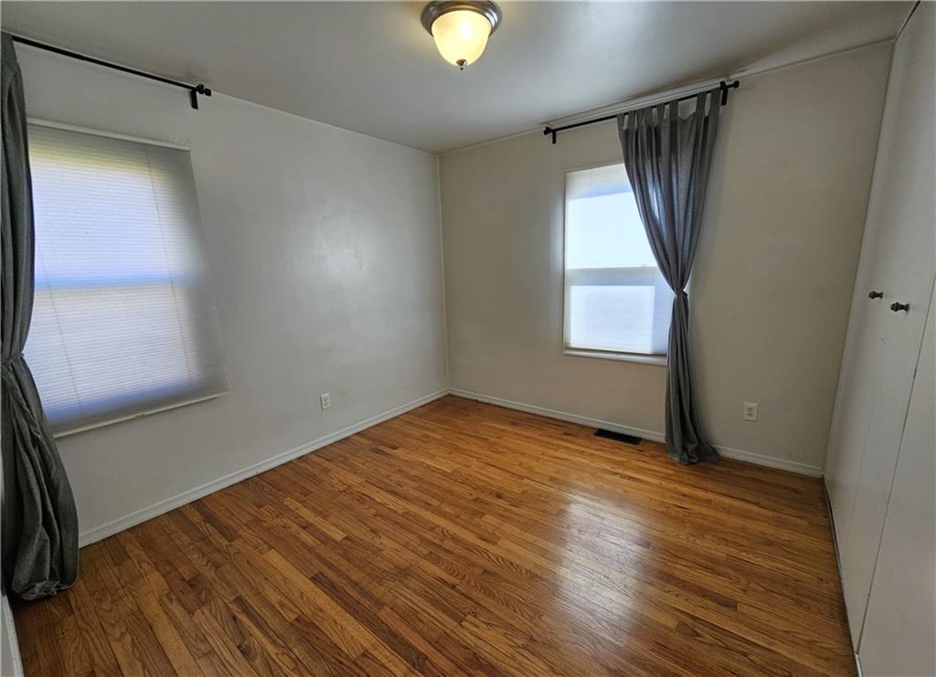 57 Old York Road Washington, PA 15301 - Photo 12 of 25 a view of empty room with window and wooden floor