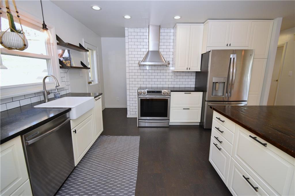57 Old York Road Washington, PA 15301 - Photo 7 of 25 a kitchen with stainless steel appliances granite countertop a sink stove and refrigerator