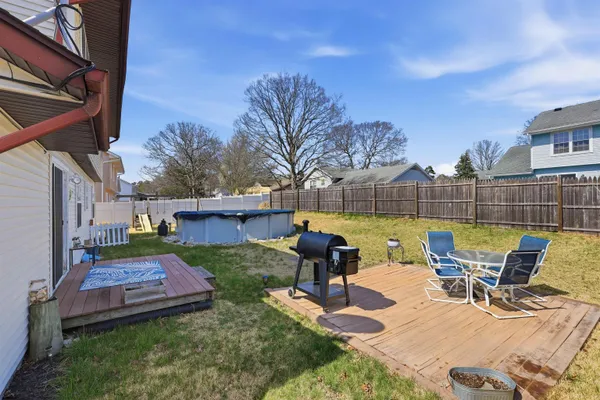 a view of a backyard with sitting area