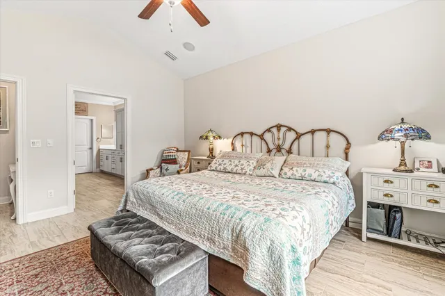 a large white kitchen with a stove a sink dishwasher and a refrigerator