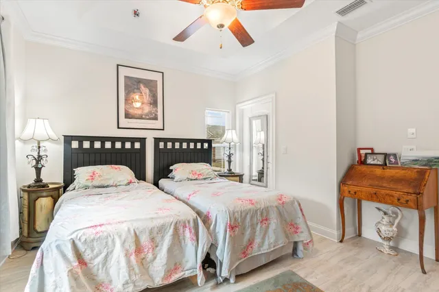 a bedroom with a bed and glass window