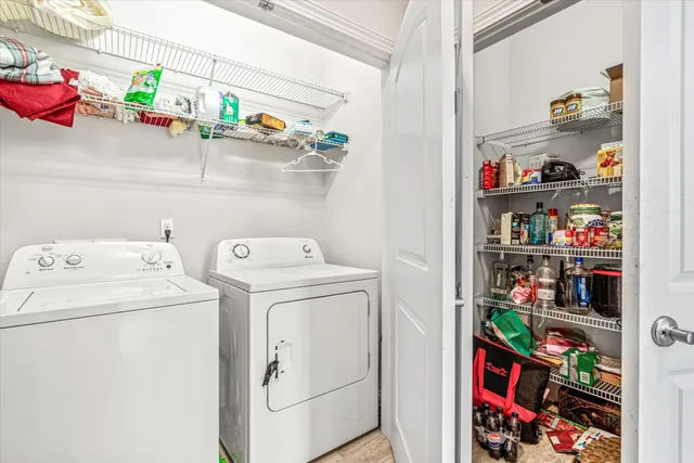 a view of a lake with couches and wooden floor