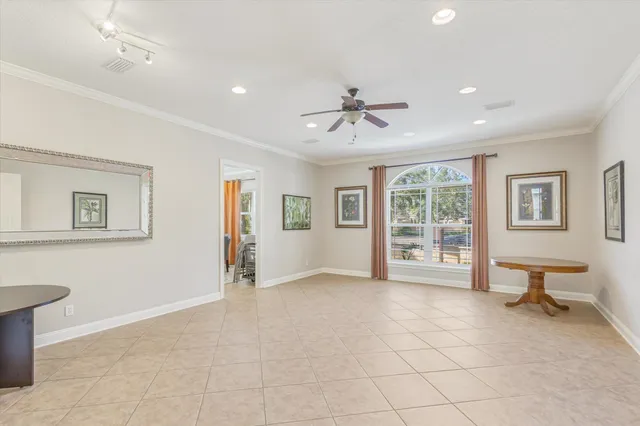 a view of a swimming pool with outdoor seating