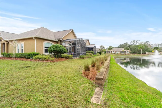 a view of a house with a yard and plants