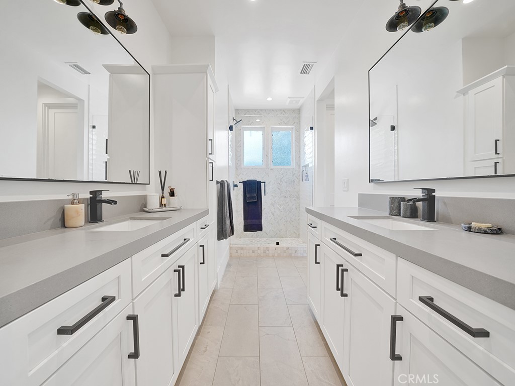 169 22nd Street Costa Mesa, CA 92627 - Photo 15 of 22 a large white kitchen with a sink and dishwasher