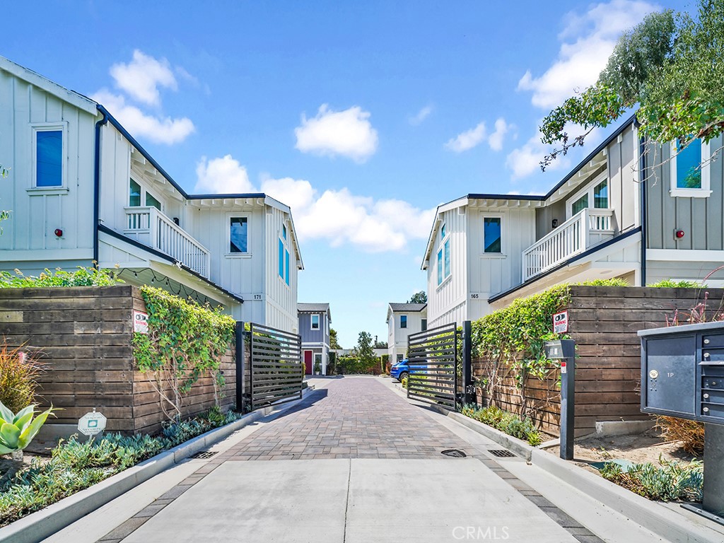 169 22nd Street Costa Mesa, CA 92627 - Photo 21 of 22 a view of a street with brick building in front of it