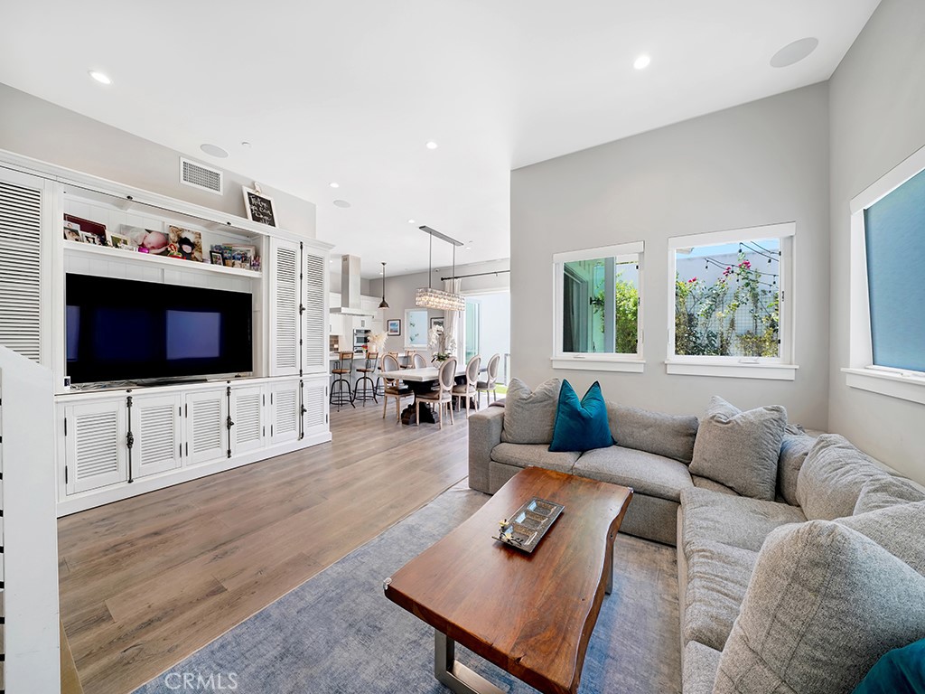 169 22nd Street Costa Mesa, CA 92627 - Photo 6 of 22 a living room with furniture and a flat screen tv