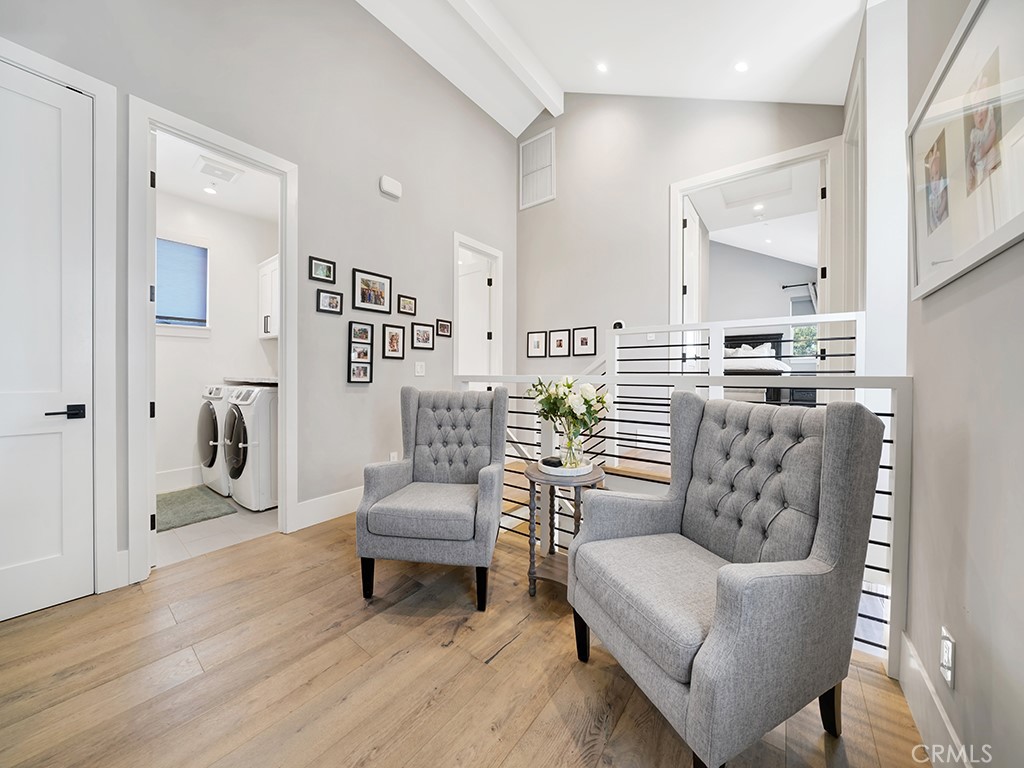 169 22nd Street Costa Mesa, CA 92627 - Photo 9 of 22 a living room with furniture and a dining table with kitchen view