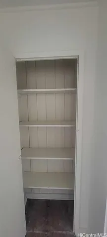 a view of storage and utility room with empty racks