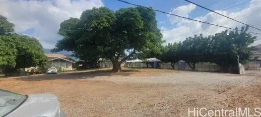 a road view with wooden fence
