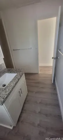 a view of a kitchen counter space and wooden floor
