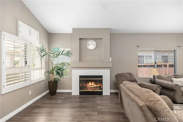 a kitchen with stainless steel appliances granite countertop a refrigerator a sink a stove and oven