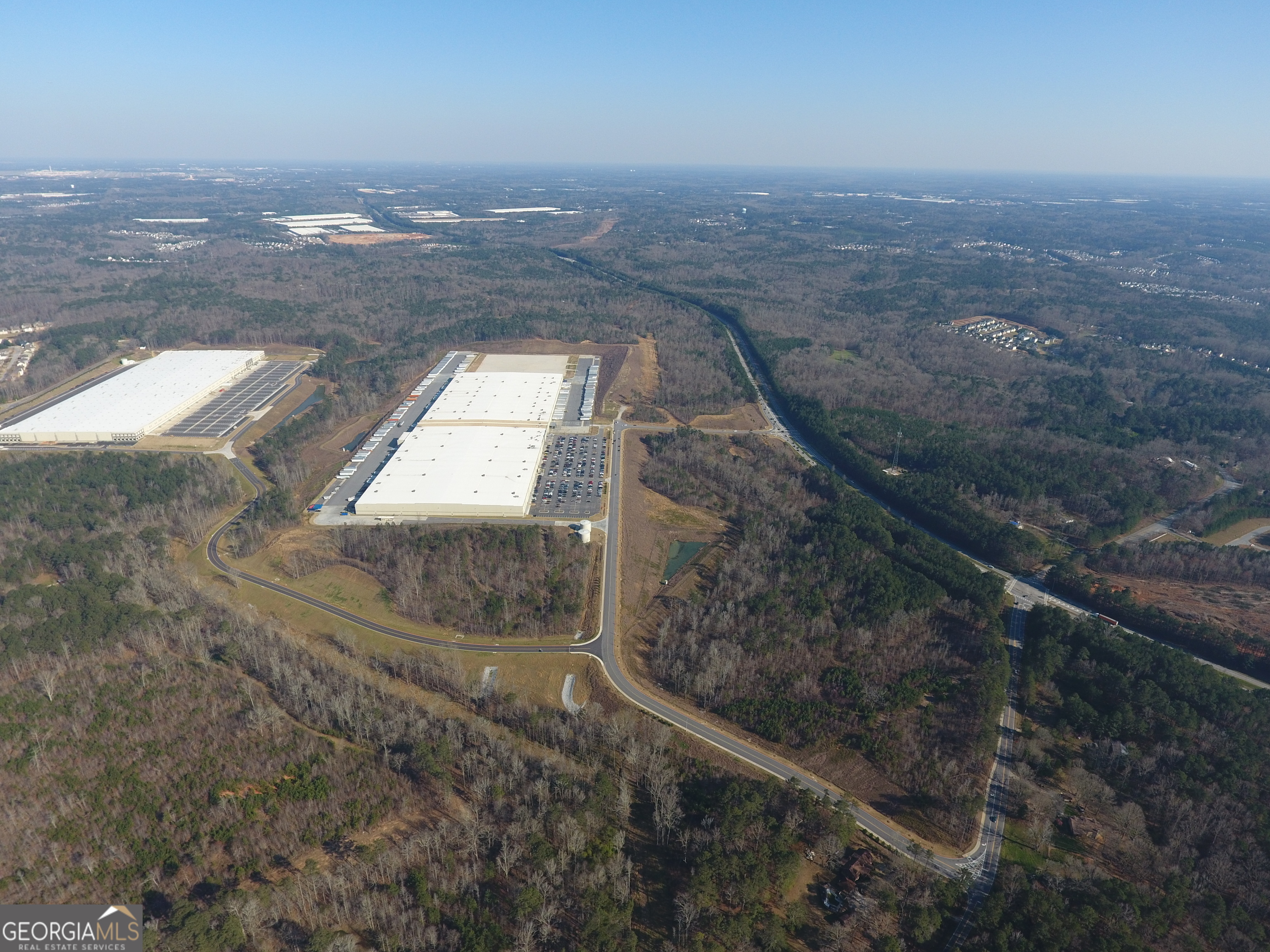 0 Derrick Road Southwest Atlanta, GA 30349 - Photo 3 of 4 an aerial view of residential houses with outdoor space