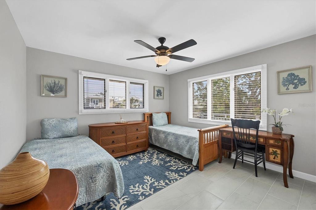 331 Bocilla Drive Boca Grande, FL 33921 - Photo 21 of 34 a bedroom with a bed and a window