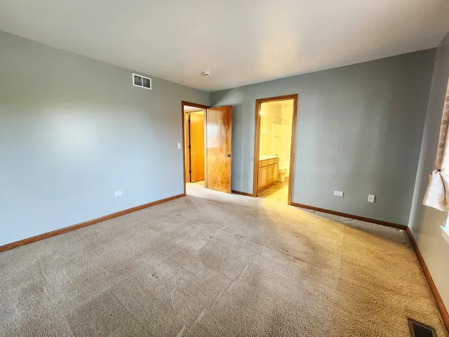 a bathroom with a double vanity sink mirror and shower