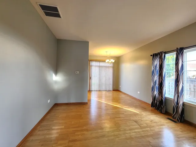a view of a kitchen with a sink and a refrigerator