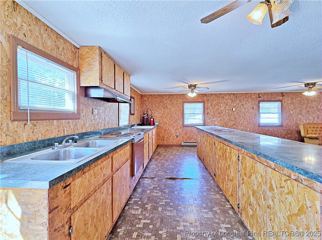 764 Old Vander Road Fayetteville, NC 28312 - Photo 35 of 50 a view of a kitchen with wooden floor and a sink