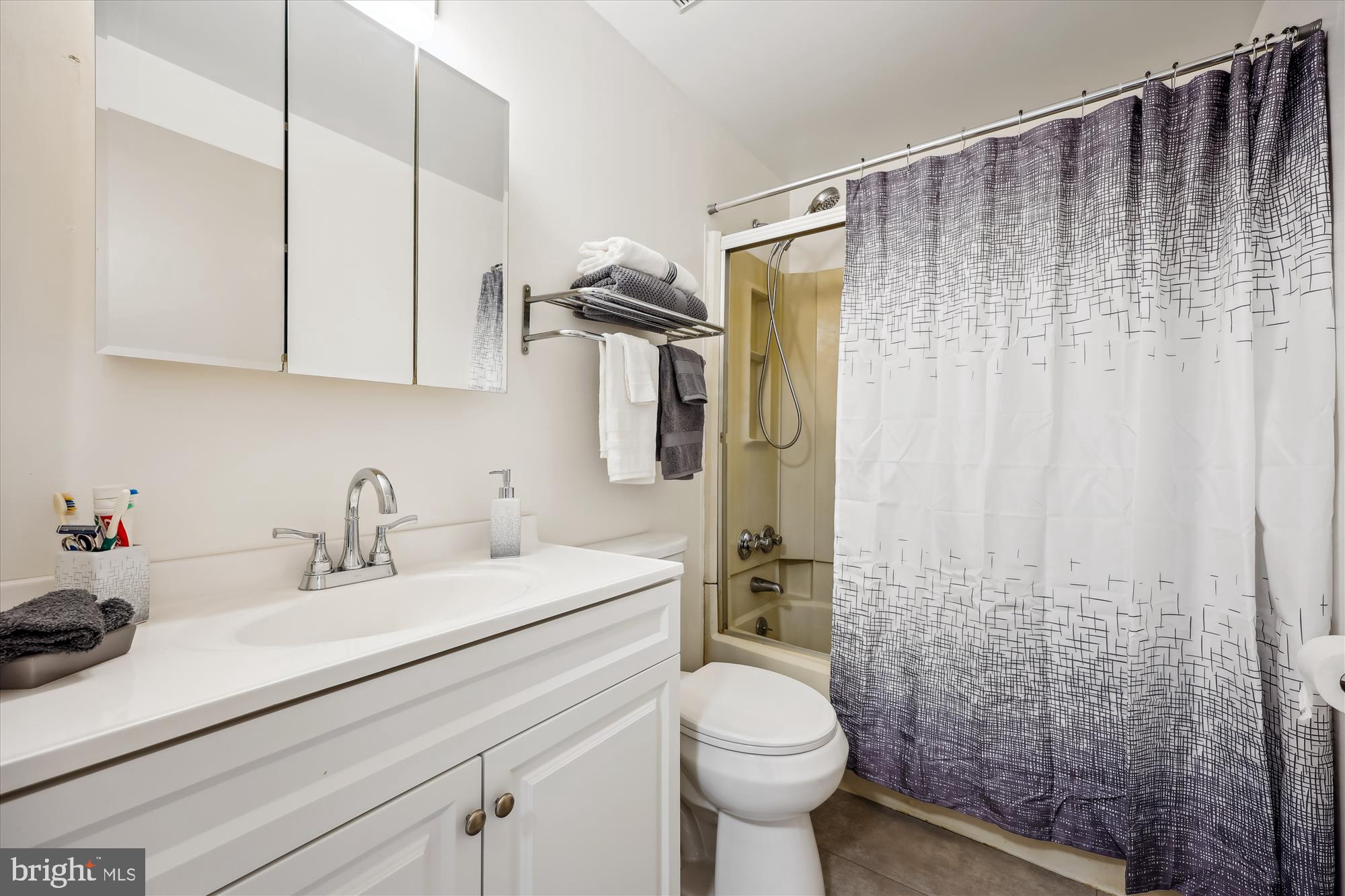 25510 Coltrane Drive Damascus, MD 20872 - Photo 16 of 50 a bathroom with a sink a toilet and shower
