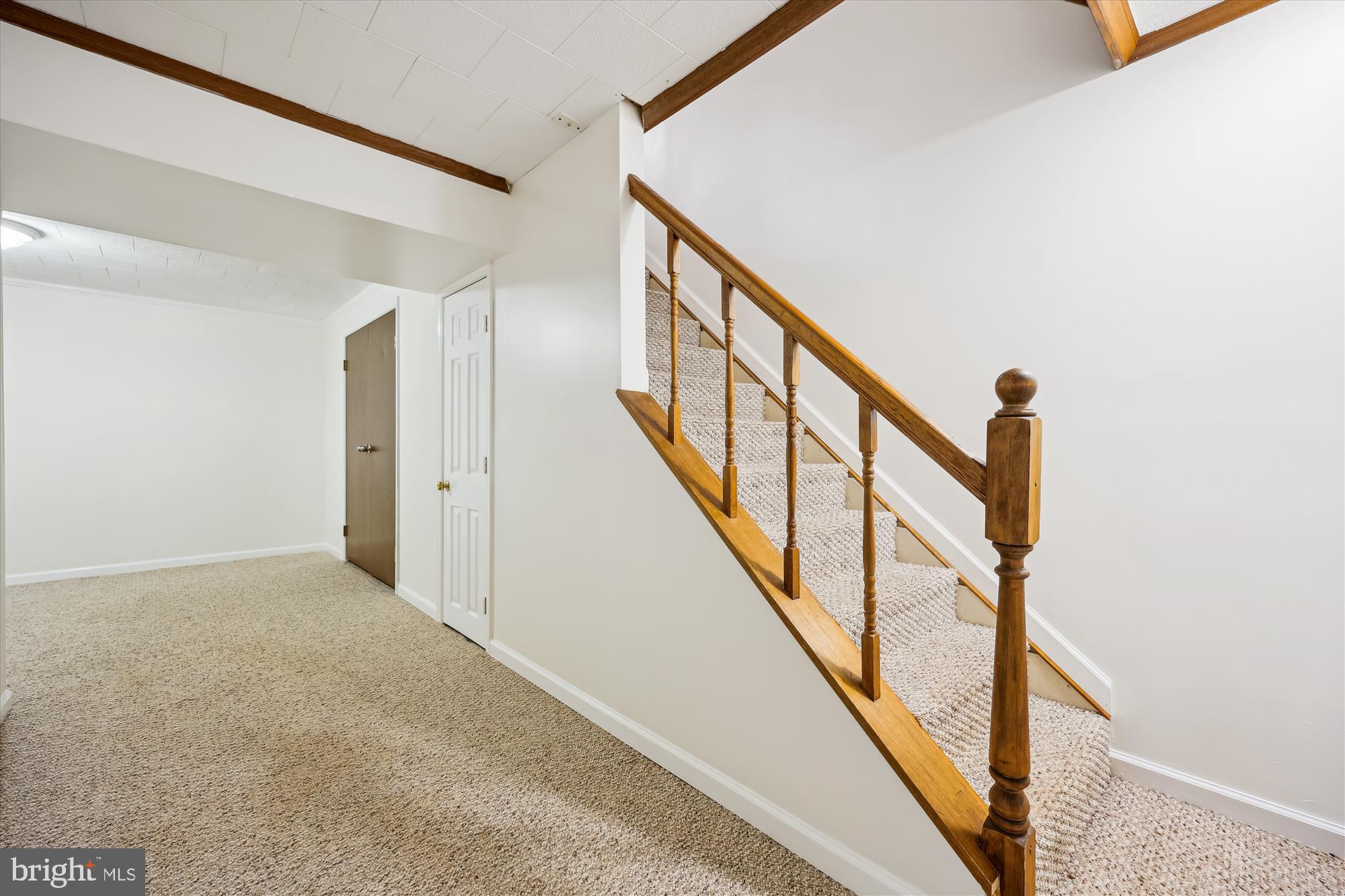 25510 Coltrane Drive Damascus, MD 20872 - Photo 19 of 50 a view of staircase with wooden floor and white walls