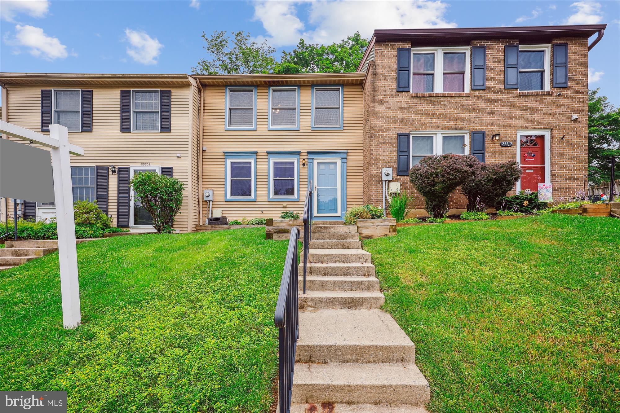 25510 Coltrane Drive Damascus, MD 20872 - Photo 3 of 50 a front view of a house with a yard and porch