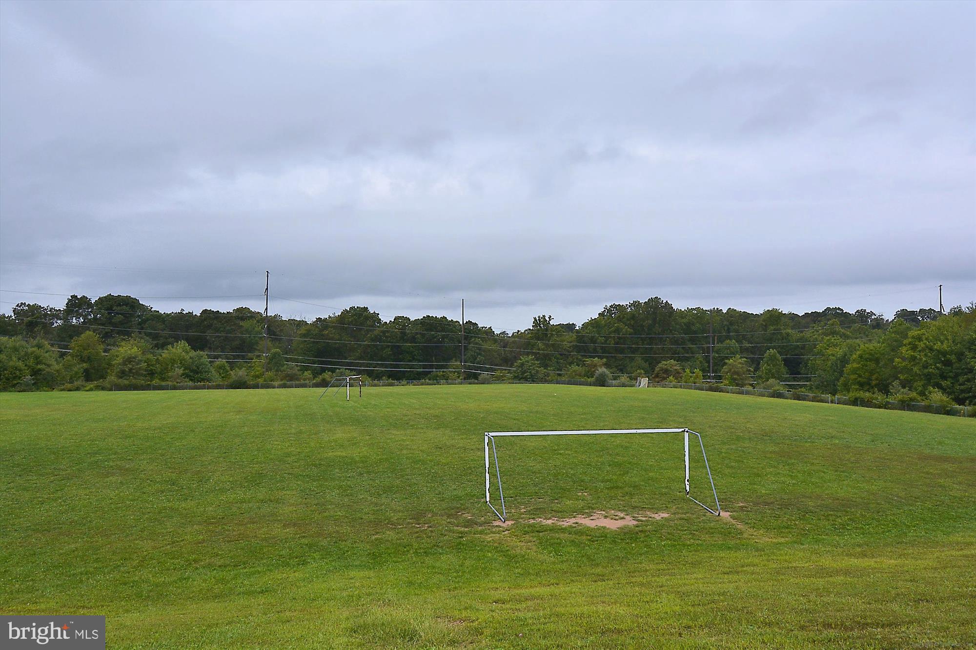 25510 Coltrane Drive Damascus, MD 20872 - Photo 36 of 50 a view of a golf course with a lake