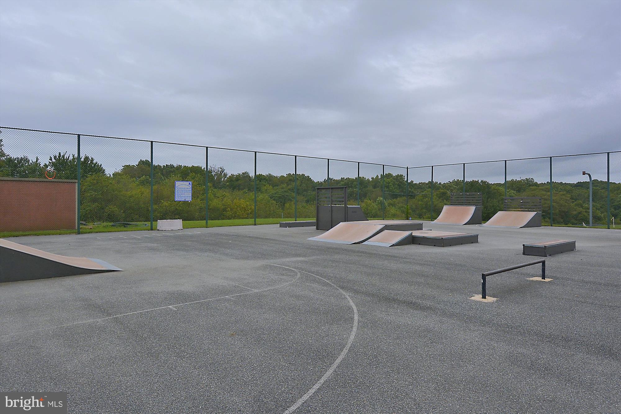 25510 Coltrane Drive Damascus, MD 20872 - Photo 37 of 50 a view of a bench in a yard
