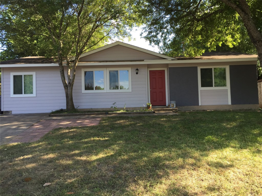 Single story home featuring a front yard