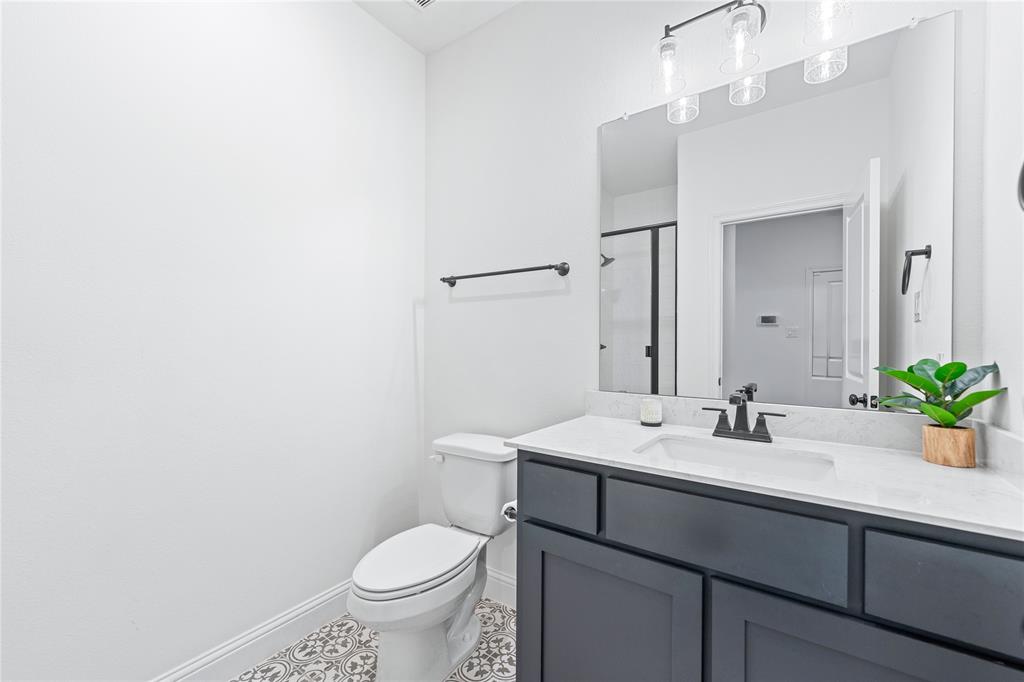5244 Ranchero Trail Fort Worth, TX 76126 - Photo 24 of 33 Bathroom with a shower stall, vanity, and light tile patterned floors