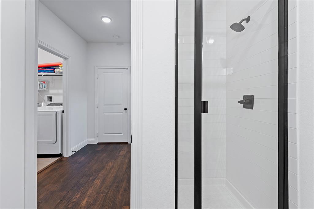 5244 Ranchero Trail Fort Worth, TX 76126 - Photo 25 of 33 Corridor featuring dark wood-type flooring and washing machine and dryer